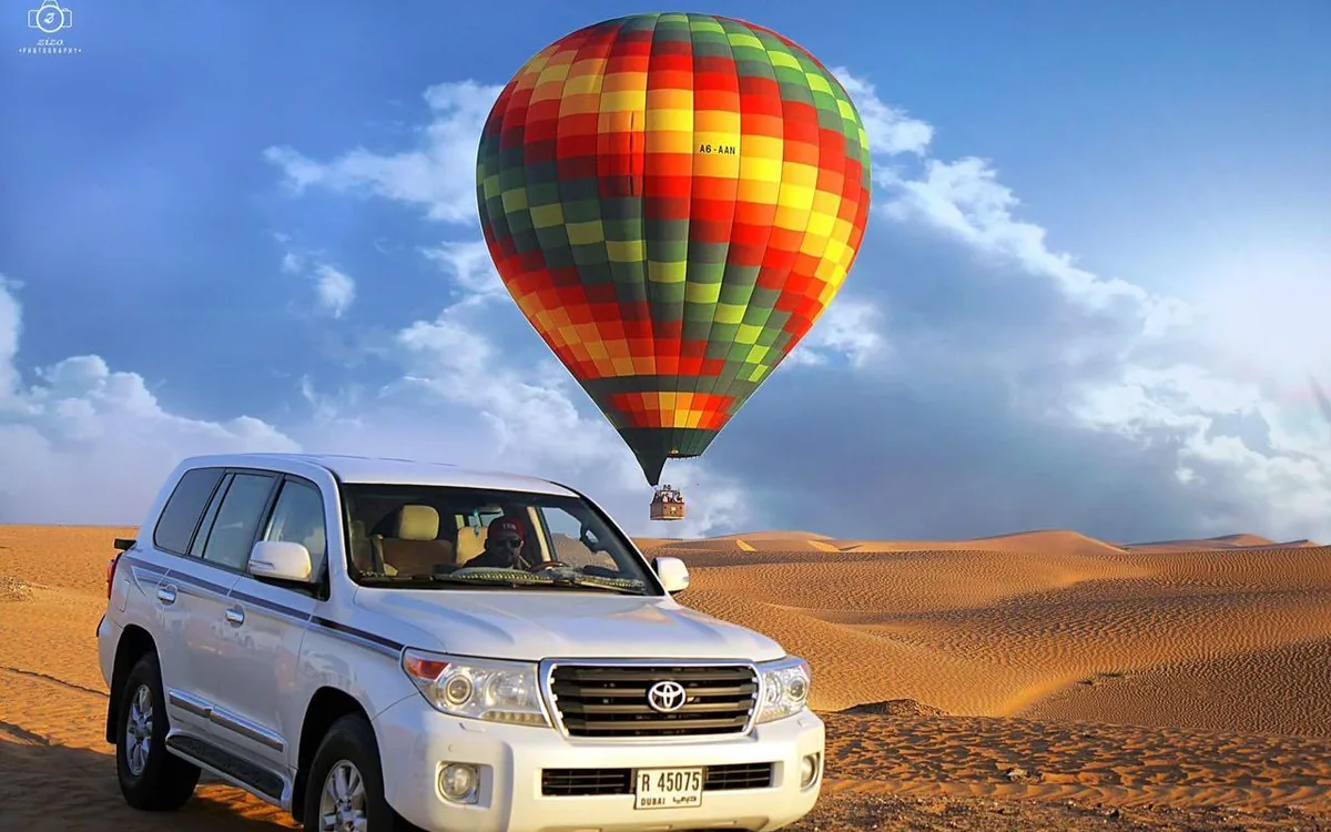 A hot air balloon over the Dubai desert at sunrise