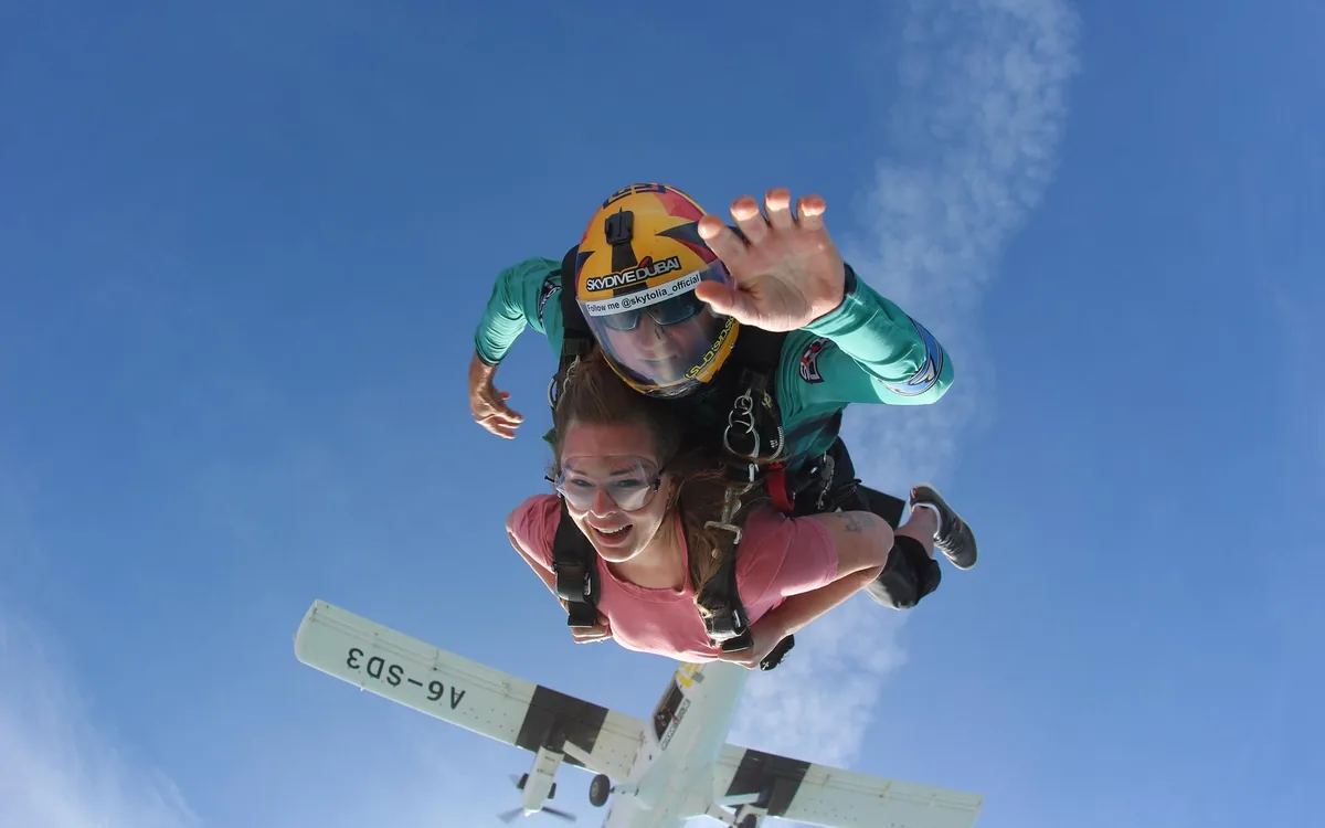 Two tandem skydivers in freefall over Dubai
