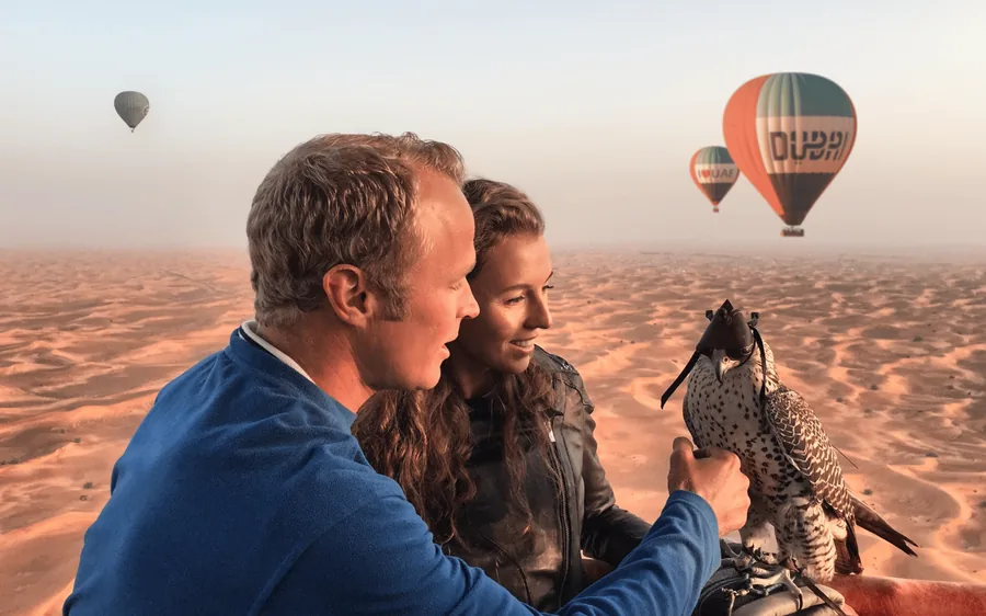 A hot air balloon over the desert with breakfast served aloft