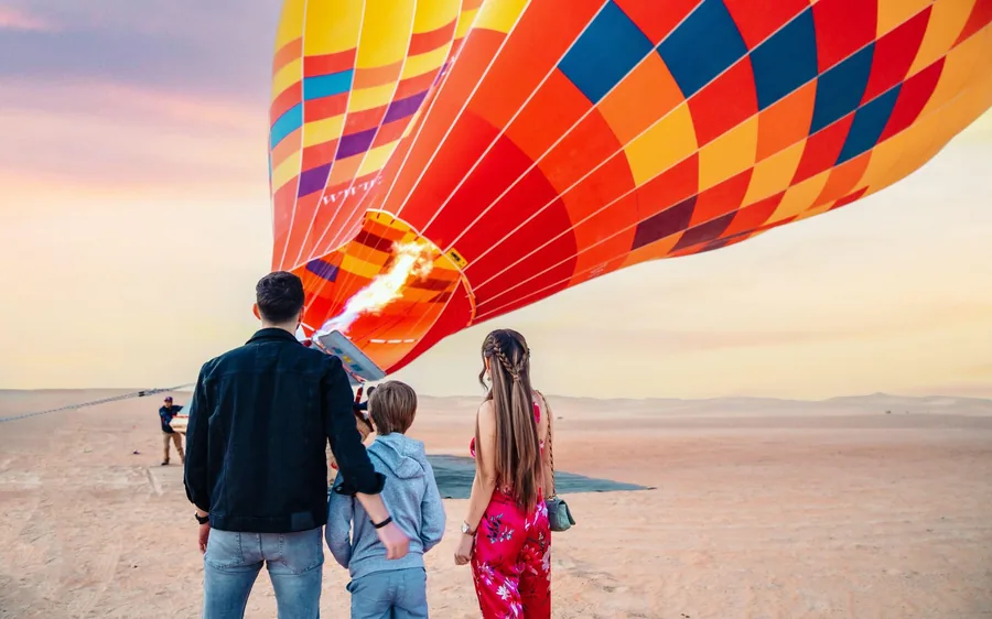 A hot air balloon being inflated in the Dubai desert